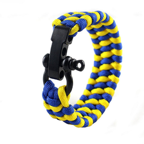 Zinc Alloy Bow Shackles 10 Pack For Paracord Survival Bracelets, shows black shackle on blue-yellow paracord bracelet