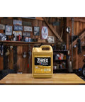 Hybrid G05 Coolant Antifreeze 50/50 Pre Mixed Six Gallon Container displayed on a wooden table in a garage setting.
