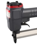 Lightweight 18 Gauge Pneumatic Brad Nailer Featuring A Durable Aluminum Frame And Reliable Trigger Action, side view with thumb trigger.