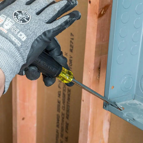 Keystone Demolition Screwdriver 5 16 Inch, 7 Inch Shank used for prying in construction setting, glove holding handle.