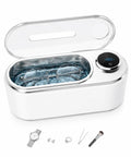Ultrasonic Jewelry Cleaner Delivers Knockout Deep Clean With 48KHz Waves 440Ml Tank with glasses submerged in water.