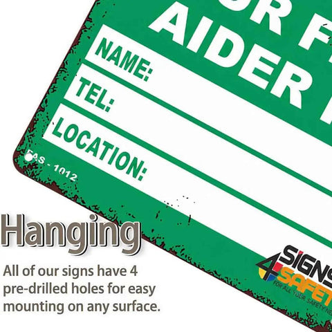 Close-up of 12 By 8 Inch Aluminum First Aider Information Sign Built To Last With Crisp Print, showing hanging holes for mounting.