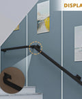 Heavy Hitter Black Wrought Iron Banister Handrails Featuring No Sweat Installation For Indoor Outdoor Stair Safety Railings With Durable Anti Rust Coating And Secure Wall Mount Grab Bars shown installed on a staircase wall.