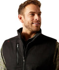 Men's Tough As Nails Fire Resistant Insulated Vest Black Large shown on model, features quick zip closure and a durable shell.
