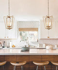 Gold Chandelier With Rotatable Geometric Frames, 4 Light Modern Lantern Pendant For Kitchen Island in stylish kitchen setting.