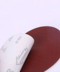 Get This Awesome 100 Piece 7 Inch Hook And Loop Sandpaper Disc Set With Grits From 60 To 1000 For Wet Or Dry Sanding Projects And Polishing That Gets The Job Done Smooth And Quick Every Single Time, showing a 7 inch red sandpaper disc being peeled.
