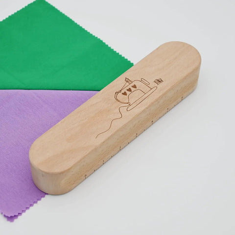 Wooden Clapper Tool For Pro Sewing And Quilting Nine Point Five Inch Hardwood Ironing Clapper To Set Seams And Creases Ideal For Quilting Projects And Seam Sewing Durable Craft Wood Block For Crisp Finish on fabric background