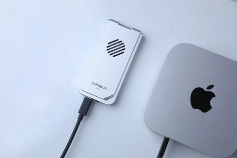 USB4 NVMe Enclosure With Active Cooling Fan And Solid Aluminum M.2 SSD Case For Mac iPad Pro connected to a Mac.