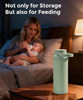 Keep It Crisp On The Fly With This Game Changing 22 Oz Breast Milk Cooler Bottle with two vials, green, on nightstand.