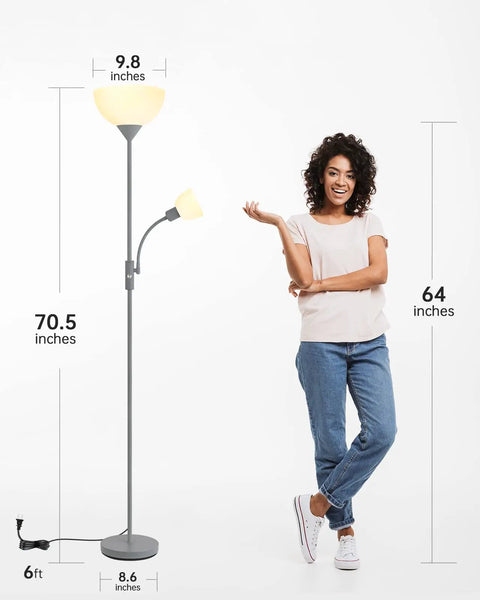 Modern Silver Floor Lamp With Dual LED Heads, 12W Main Light And 4W Adjustable Reading Lamp beside person for scale.