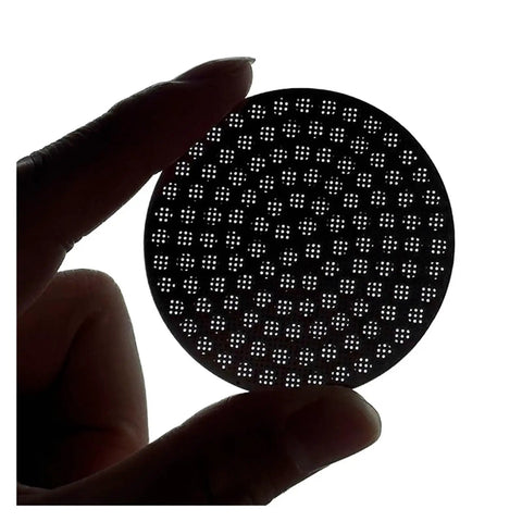 Top Shelf Reusable Espresso Puck Screen Built From Heavy Duty 304 Stainless Steel Fits 51mm 54mm And 58mm Baskets held in hand.