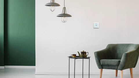 7 Day Programmable Touchscreen Thermostat For Home Climate Control White Renewed Edition mounted on wall in modern living room