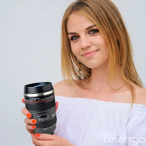 Woman holding Camera Lens Coffee Mug With Clear Lid And Spoon, Lightweight Lens Cup Replica For Photographers, Realistic Lens Design