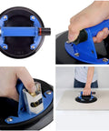 Heavy Duty 8 Inch Glass Suction Cup With Metal Handle being gripped for lifting, showcasing the ergonomic design and strong suction.