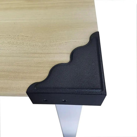 Keep Your Walls Pristine With These Tough Black Metal Corner Protectors Featuring Rust Resistant Build And Slick Smooth Edges For 3.7 Inch Wall Edge Shield Four Pack, showing a corner protector on a wooden surface.