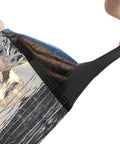 Tough As Nails Self Adhesive Roofing Underlayment Roll being peeled back to reveal sticky underside for easy application.