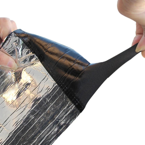 Tough As Nails Self Adhesive Roofing Underlayment Roll being peeled back to reveal sticky underside for easy application.