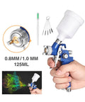 Pro Level Pneumatic Paint Spray Gun With One Millimeter Nozzle spitting even mist, 125ml clear fluid jar, lightweight hand-held design.