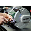 User sharpening a drill bit on a Heavy Duty 8 Inch Bench Grinder With 3600 Rpm And 5.5 Amp Motor delivering top shelf shop performance.