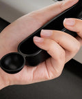Close-up of hand holding the ergonomic handle of Grouphead Cleaning Brush For Espresso Machines 9 Inch Nylon Bristle Brush With Protective Guard