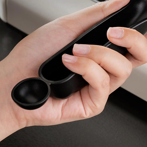 Close-up of hand holding the ergonomic handle of Grouphead Cleaning Brush For Espresso Machines 9 Inch Nylon Bristle Brush With Protective Guard