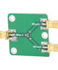 Built To Last Two Way RF Power Splitter PCB Board DC To Five Gigahertz Frequency Range With Six Decibel Attenuation, green PCB with SMA connectors.