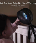 8000mAh Portable Stroller Fan With Ultra Long Battery Life attached to baby crib with LED night light on