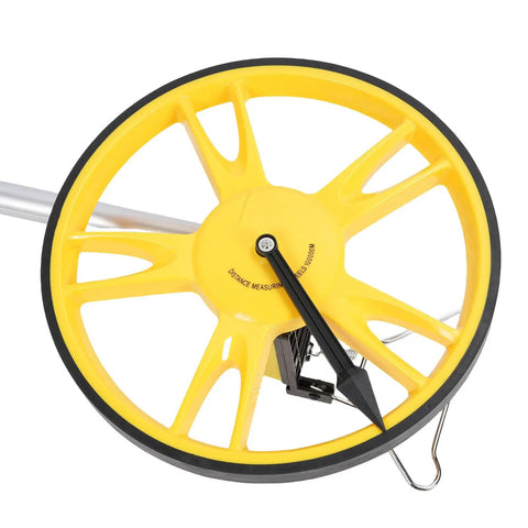 Close-up of Fauitay Mechanical Measuring Wheel with Folding Handle, 9999.9m Distance showing yellow wheel and measurement pointer.
