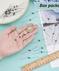 Hand holding 30 Piece Stainless Steel Torsion Springs Set With 0.5mm Wire Diameter And 4.5mm Outer Diameter 180 Degree Deflection