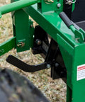 Close-up of green 3 Point 10 Cu Ft Dump Box For Category 1 Tractors with quick hitch lock and black lever