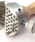 Universal Peg Clamp Work Holder Vise Tool with 8 pins and 60 holes on a 2 inch aluminum face, wooden handle visible
