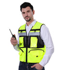Heavy Duty High Visibility Safety Vest Featuring Breathable Mesh Lining Multiple Storage Pockets And Bright Fluorescent Yellow Fabric For Construction Crew Daily Grind And Rugged Shop Tested Workwear worn by a man holding a radio.