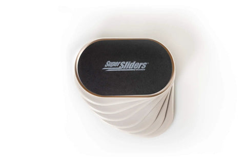 Stack of Oval Five And Three Quarter Inch By Nine And A Half Inch Reusable Furniture Sliders For Carpet, Beige, Eight Pack