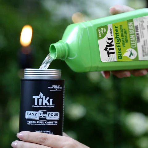 Pouring Clean Burn Mosquito Repellent Torch Fuel For Outdoor Use Easy Pour One Quarter Gallon 32 Oz Smokeless Low Soot Citronella into canister