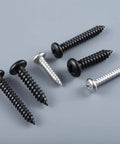 Number Eight By Three Quarters Inch Self Tapping Pan Head Wood Screws With Phillips Drive And Black Oxide Finish For Sturdy Timber And Thin Metal Projects Built Hella Tough With Zero Rust Drama Included displayed on a gray background.