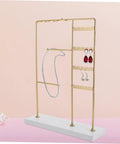 Spin Your Daily Drip Easily With This Smooth Rotating Jewelry Tree Stand Constructed From Premium Iron And Solid Marble For Necklaces And Earrings Storage, showcasing necklaces and earrings.