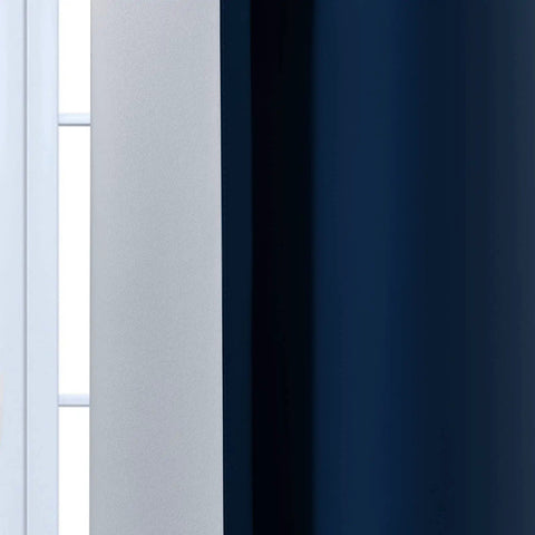 Close-up of Blue And Gray Ombre Curtain Panels 63 Inch Length Two Pack, Room Darkening Gradient Window Drapes, hung on a window.