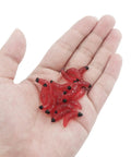 Hand holding red maggots from 250 Piece Soft Plastic Fishing Worms Lures Set Realistic Earthworm Baits For Freshwater Fishing Reusable Fake Maggots