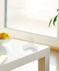 10 Pack Table Corner Guards For Kids And Pets, Soft PVC Edge Protectors on white table in bright room