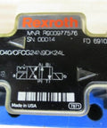 Close-up of the Hydraulic Solenoid Directional Control Valve 4WE10D40/OFCG24N9DK24L, PN R900977576, showing identification details.