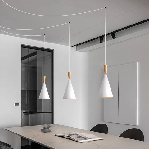 White Plug In Pendant Light Dope Cone Farmhouse Style for kitchen island with three hanging fixtures in modern room.