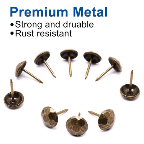 Pro Grade Bronze Upholstery Tacks And Decorative Furniture Nails For Wood Restoration rust resistant metal thumb pins arranged on white background.