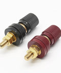 Beefy One Quarter Inch Remote Battery Terminal Stud Pair Featuring Pure Copper Build And Bakelite Shielding For High Amp Draws, showing red and black terminals.