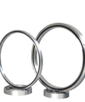 Rock Solid Cross Roller Slewing Ring Bearing RA808UUCC0 in two sizes, designed for heavy industrial platforms, showcasing durable steel.