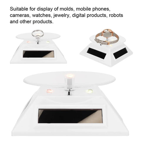 Xhtllo Electric Led Light Solar Powered Rotating Turntable Display Stand For Jewelry Phunique Watches Camera And Decorations with white base.
