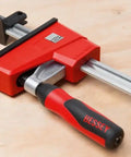 K-BODY REVOlution 12 Inch Parallel Clamps With Composite Plastic Handle And Three And Three Quarters Inch Throat Depth Two-Pack Delivers Up To 1700 Lbs Clamping Force For Heavy Duty Glue-Ups Smooth Action And Quick Setup with close-up on handle