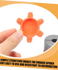 Person holding an orange flexible rubber jaw coupling insert pad for CNC machines, shock absorbing center cushion, L shaped claw compatible