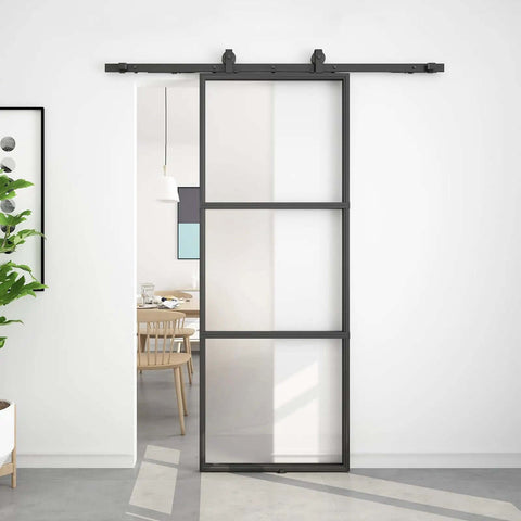 Frosted Glass Sliding Barn Door With Black Carbon Steel Frame 36In By 96In Soft Close Mechanism in modern living room.