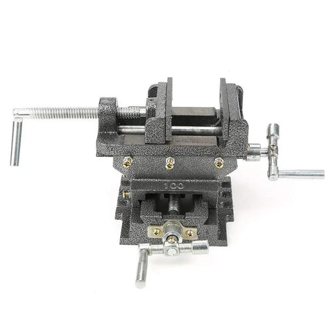 Beefy 4 Inch Cross Slide Vise With Heavy Duty Clamping Power For Milling Machines And Drill Presses Steel Construction Wide Jaws For Secure Workpieces And Precise Cuts Ready For Any Heavy Metal Working Project, front view with handles