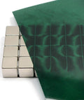 Green Magnetic Viewing Film 4x6 Inches for Magnetic Field Visualization displaying field patterns with stacked magnets behind it.